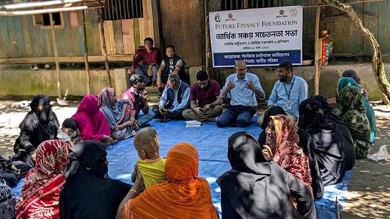 Bangladeshi microfinance clients attending a financial literacy or business awareness session