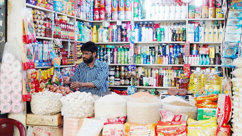 Bangladeshi small business owner working inside a local shop or microenterprise